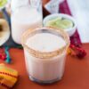 A high bal glass filled with homemade Horchata with a sugar rimmed edge.