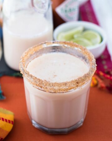 A high bal glass filled with homemade Horchata with a sugar rimmed edge.