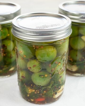 Pickled green cherry tomatoes.
