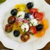 Overhead of a salad plate with a serving of tomato salad.