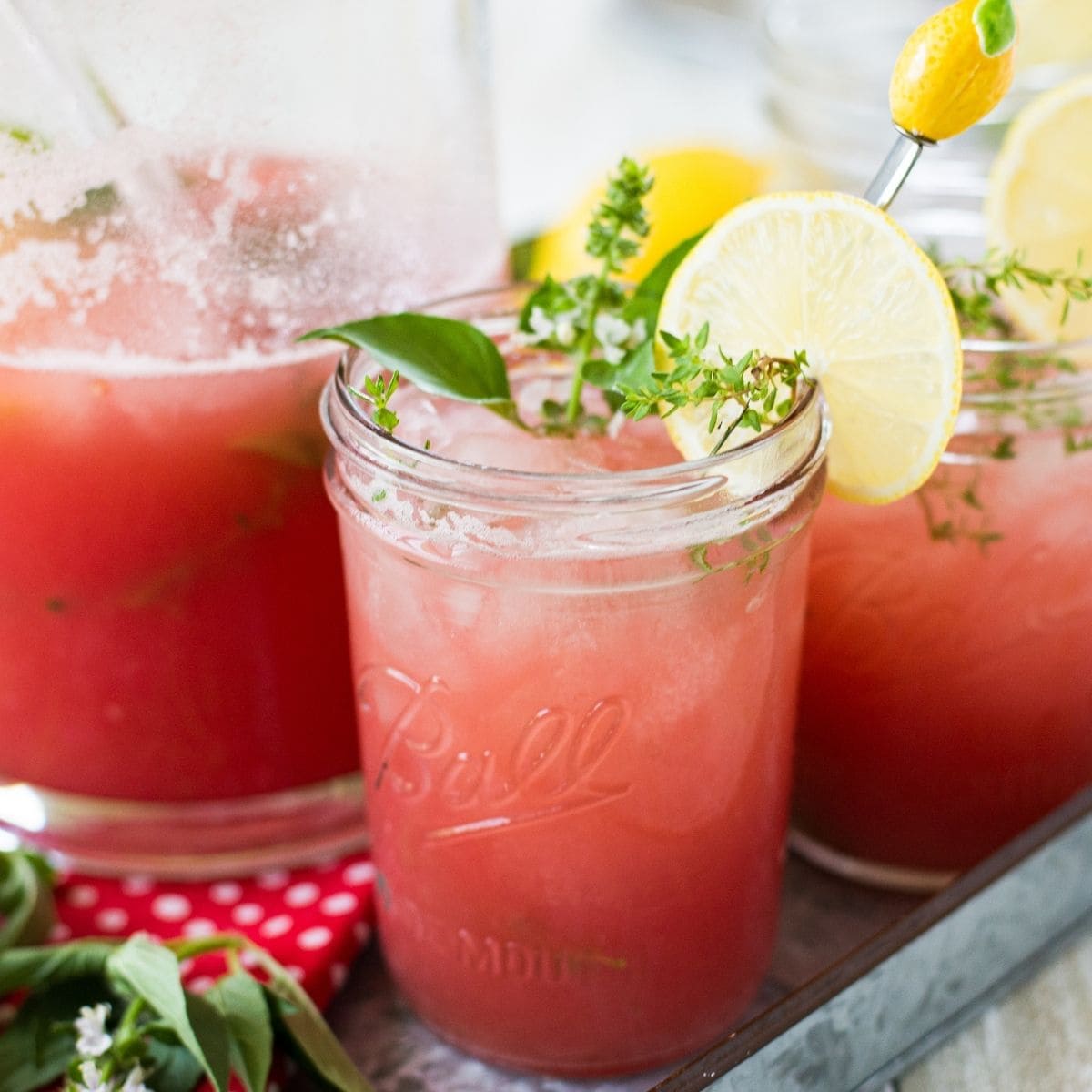 Mason jars filled with Watermelon Thyme Lemonade.