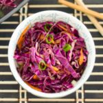 a bowl filled with red Asian slaw.