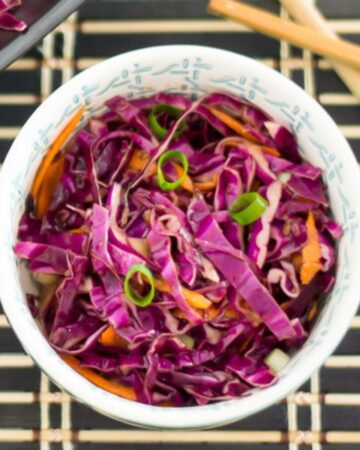 a bowl filled with red Asian slaw.
