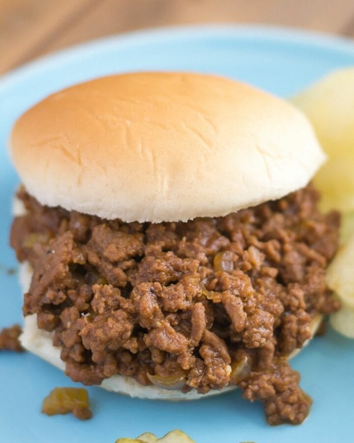 Crock Pot Sloppy Joes on a plate served with chips.
