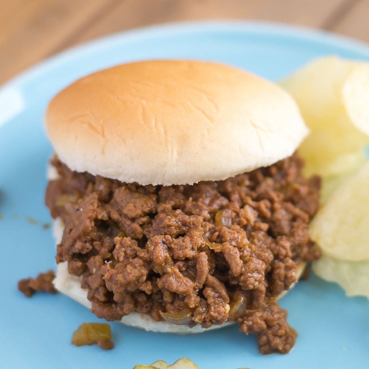 Crock Pot Sloppy Joes on a plate served with chips.