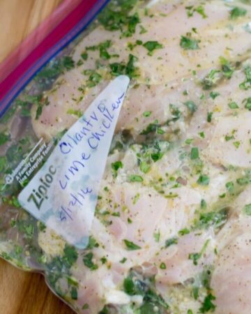 A freezer bag filled with cilantro lime marinated chicken breasts.