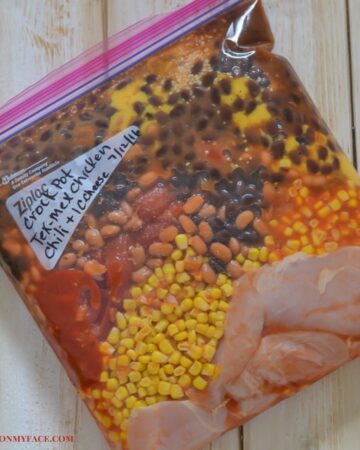 Ingredients for freezer meal chicken chili in a freezer bag.