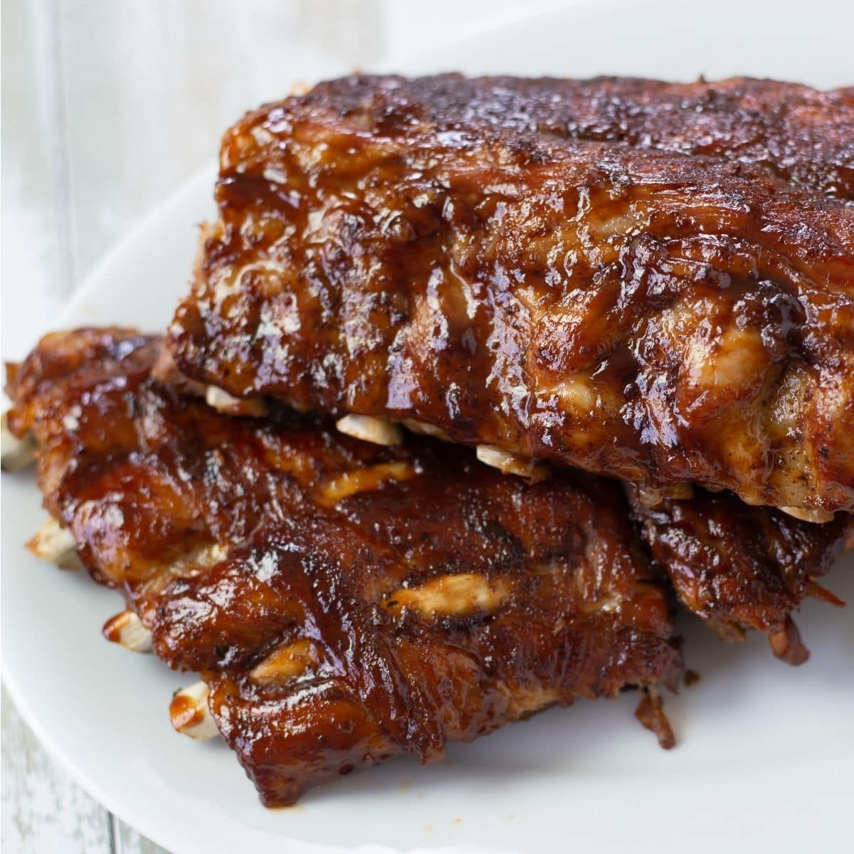 Two racks of Instant Pot Baby Back Ribs on a serving platter.