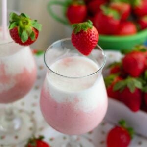 Layered strawberry and cream smoothie.