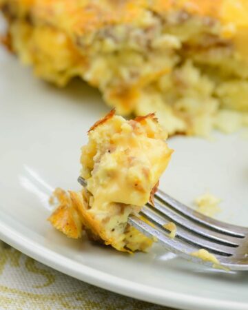A closeup of a forkful of cheesy Velveeta Breakfast Casserole.