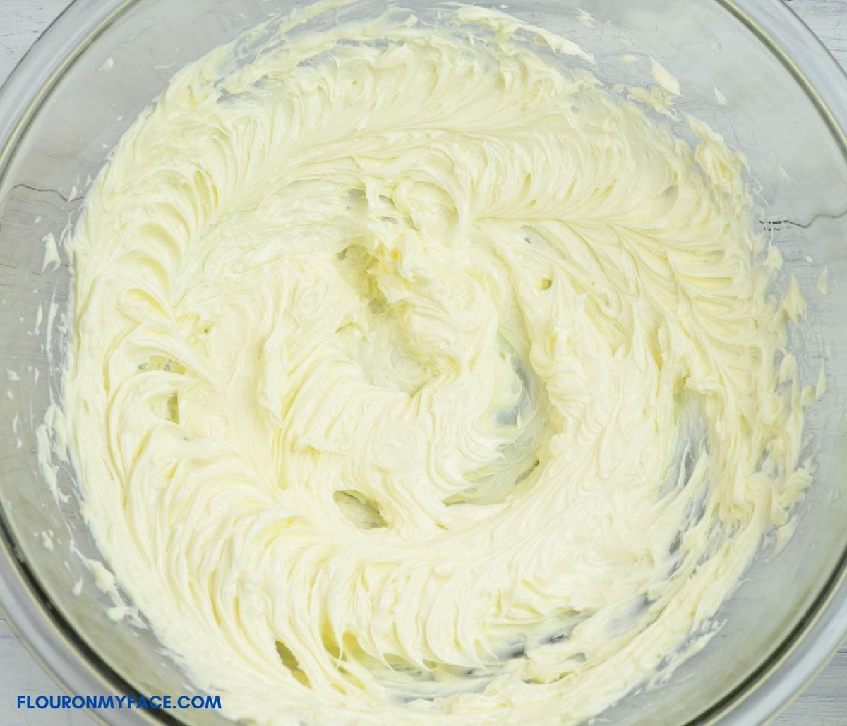 Creamed butter in a large mixing bowl.