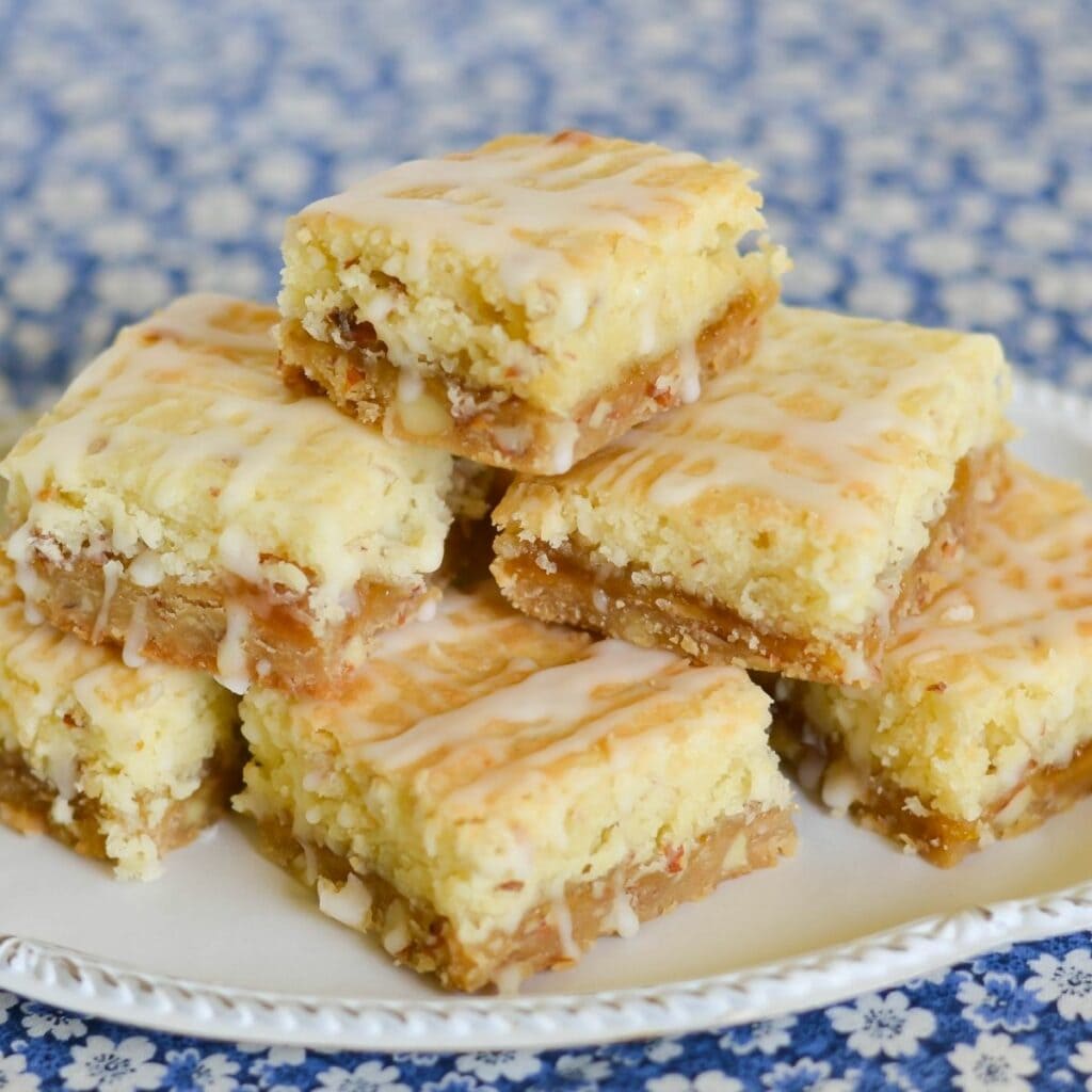Peach bars piled up on a serving plate.