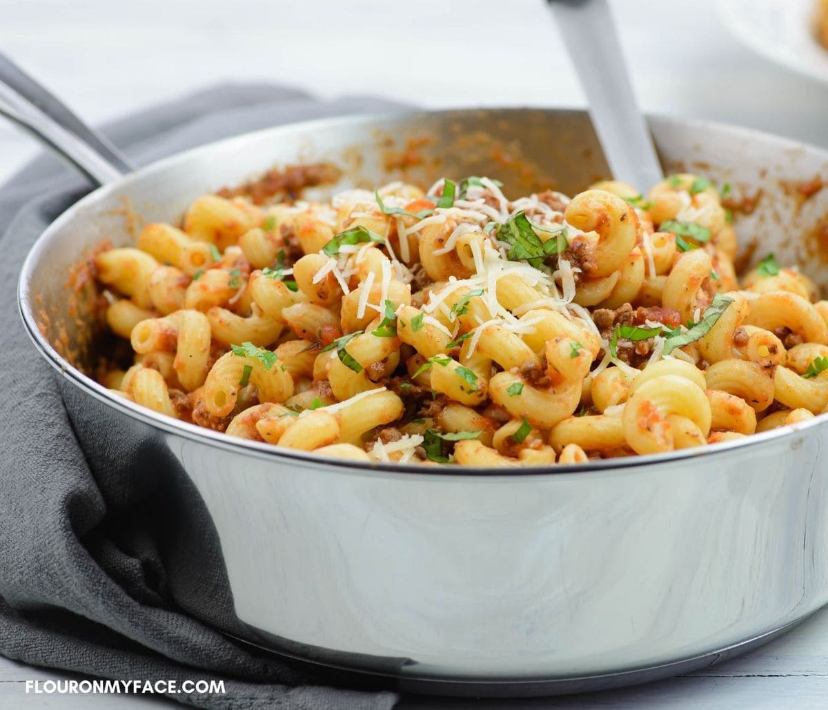 Serving skillet pasta from a deep skillet.