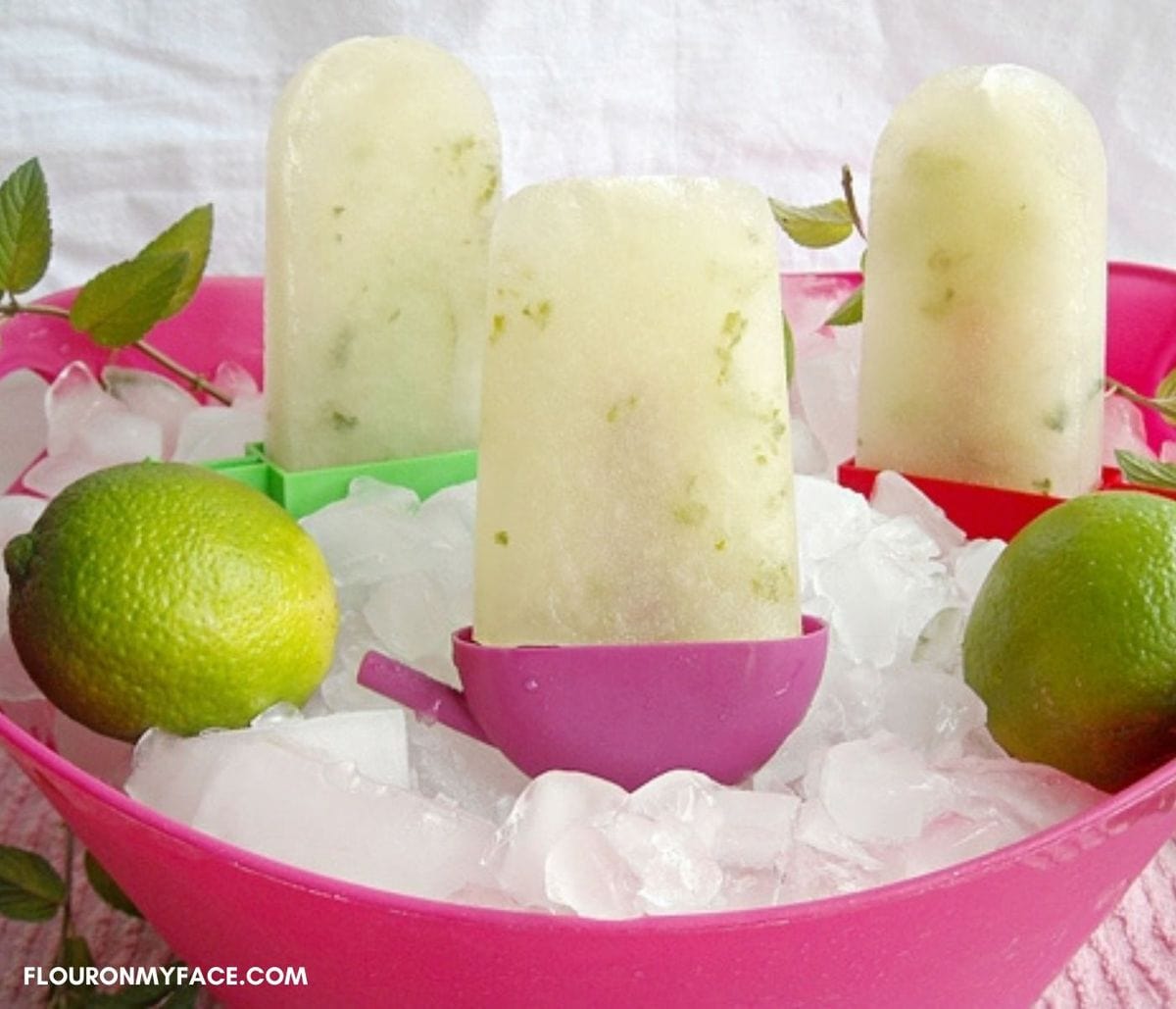 Bucket of ice filled with virgin mojito ice pops.