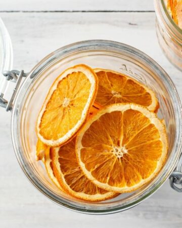 Dehydrated Orange Slices in a wide mouth mason jar.