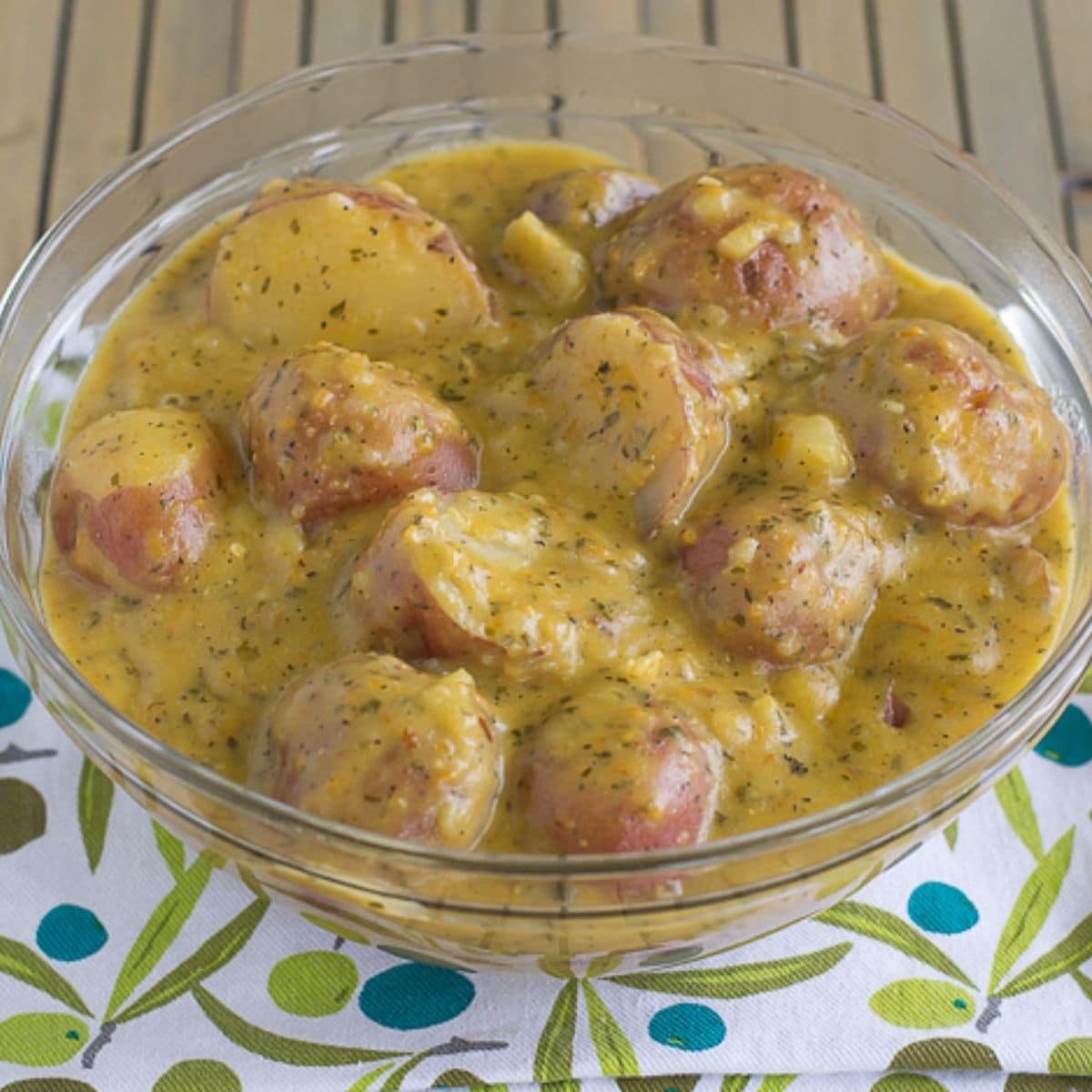 A bowl filled with crock pot cheesy ranch potatoes.