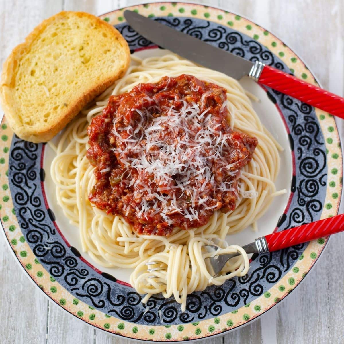 Homemade spaghetti meat sauce made in a slow cooker and served over pasta.