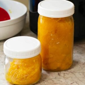 Two glass jars filled with homemade pumpkin puree.