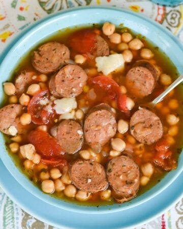 Sausage Garbazo Bean Soup in a bowl on a place mat.