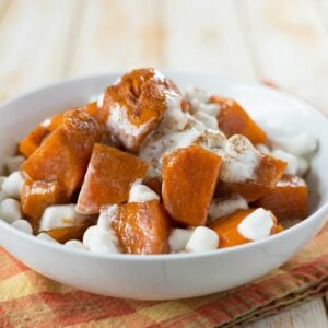 A bowl of sweet and tender Instant Pot Sweet Potatoes topped with marshmallows.