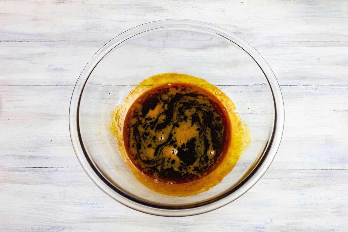 Hot honey and molasses in a glass bowl to cool.