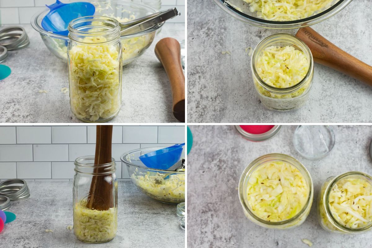 Filling a glass jar with sauerkraut and pounding it down.