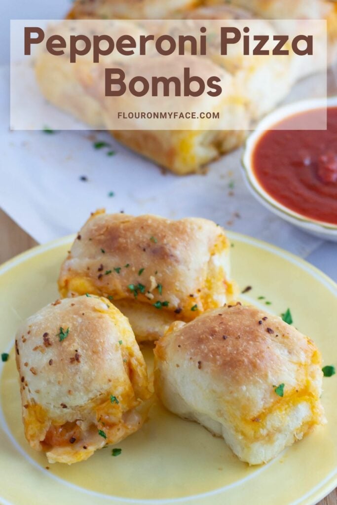 Pepperoni Pizza Bombs made with real pizza dough on a plate.