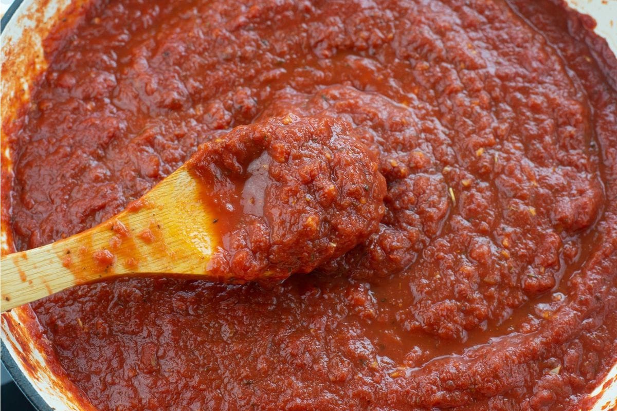 A spoonful of thickened pizza sauce.