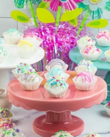 Easter Cake Balls on colorful cakes stands.