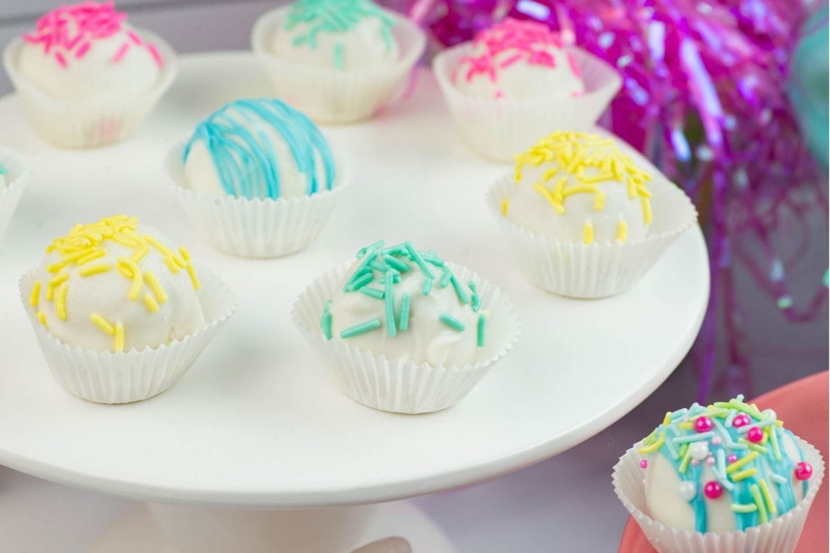 Spring Cake Balls decorated with pastel colored sprinkles.