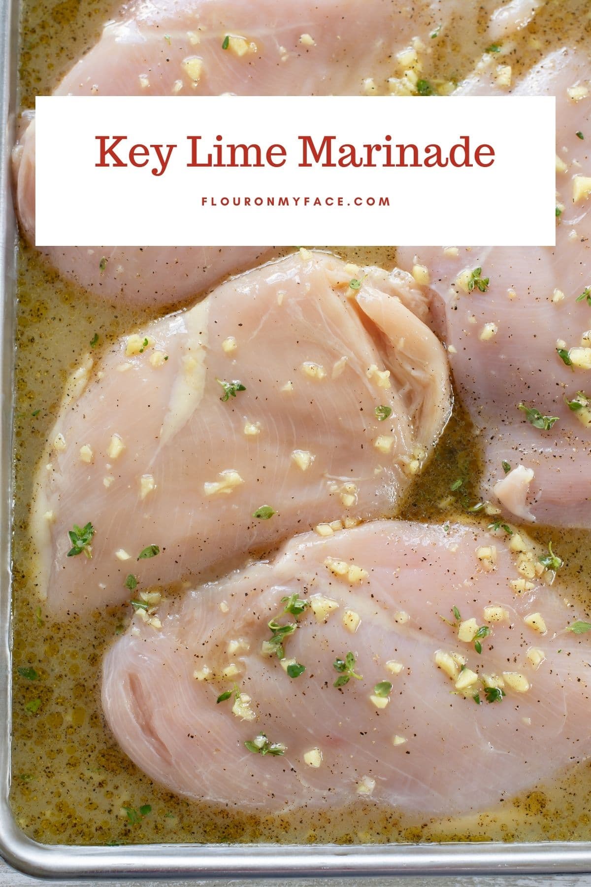Boneless skinless chicken breasts marinating in key lime juice and garlic marinade.