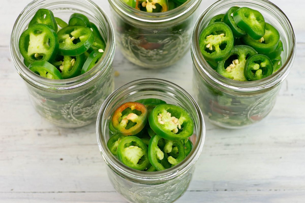 Example of what packing canning jars with jalapeno slices look like.