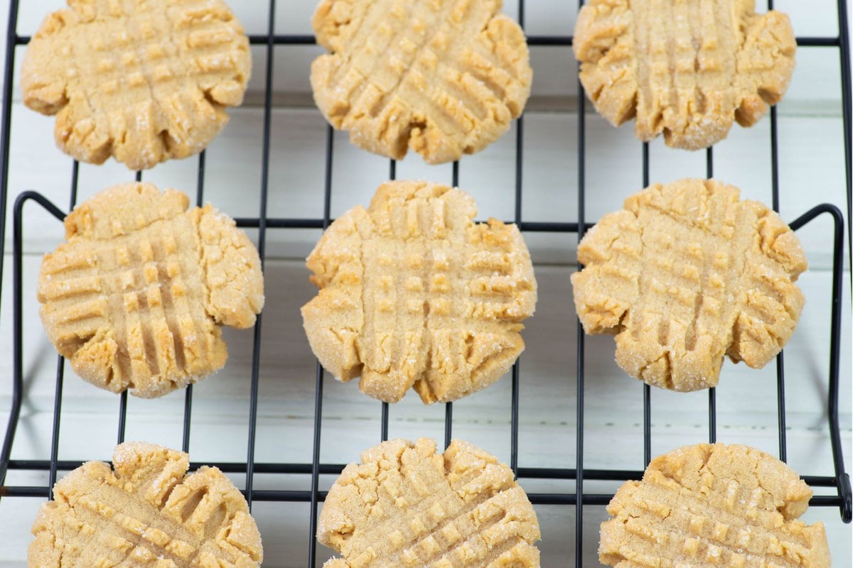 Cooling peanut butter cookies on a wire rack.