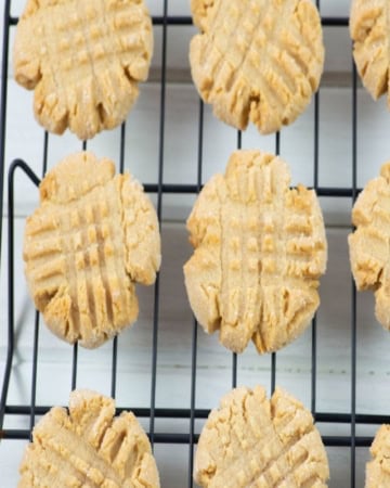 Cooling peanut butter cookies on a wire rack.