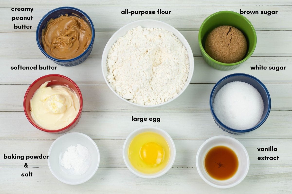 Peanut butter cookie ingredients in small bowls.