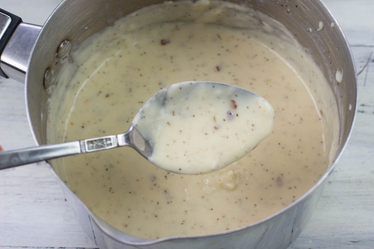 A tablespoon full of thickened alfredo sauce.