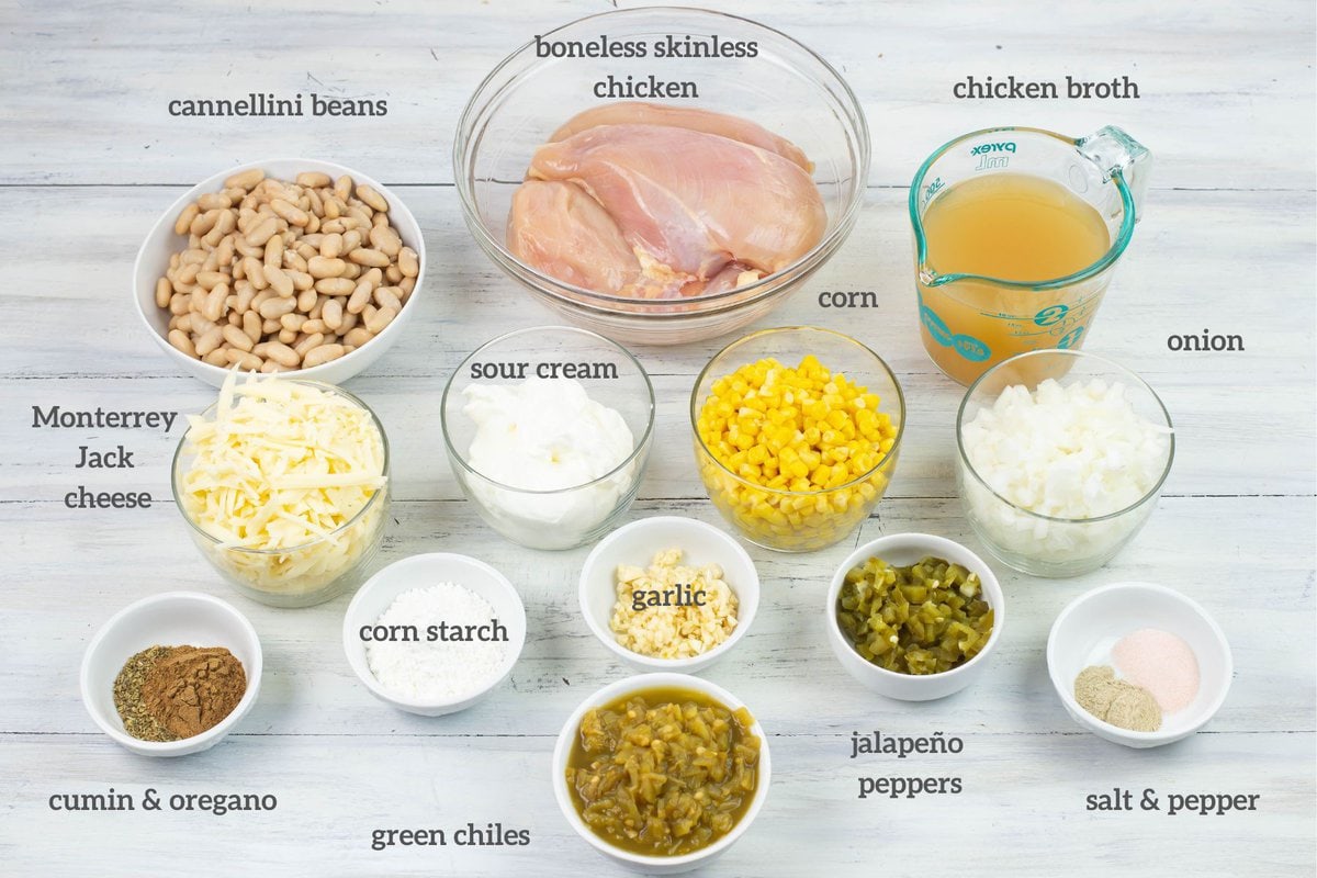 Cheesy chicken chili ingredients measured out in individual bowls.