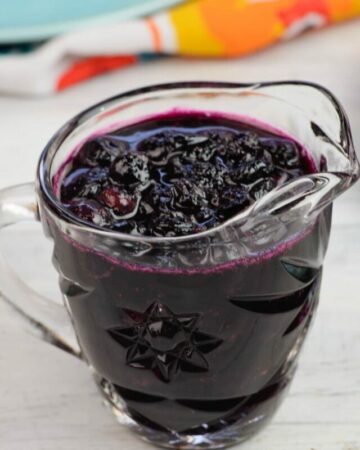 Homemade blueberry sauce in a vintage glass