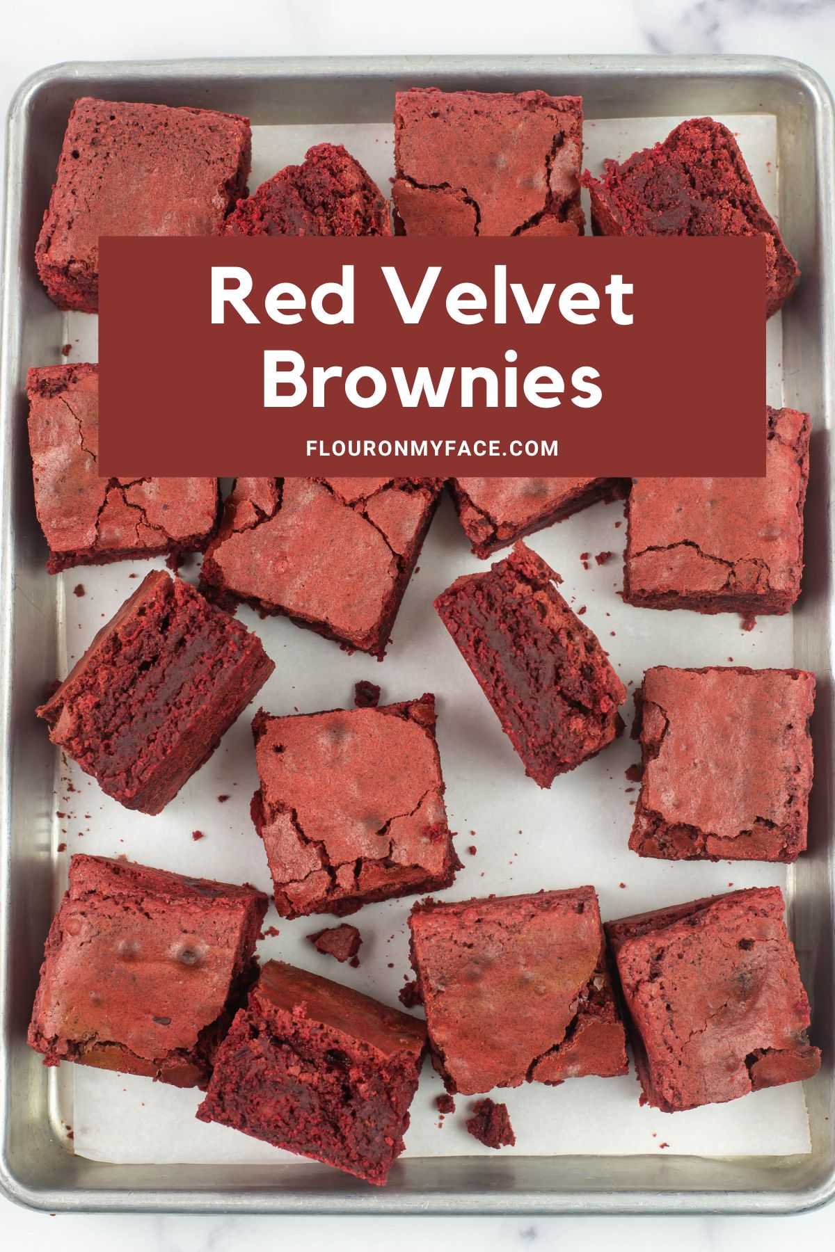 Long vertical Pin image of 16 red velvet brownies on a aluminum baking pan.