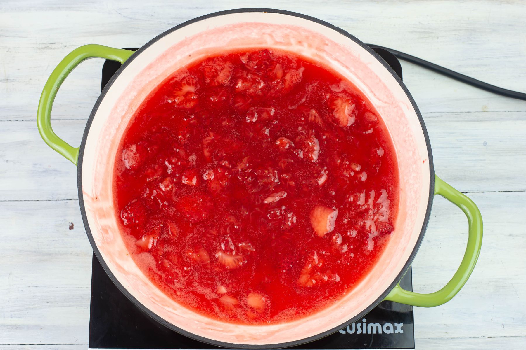 Strawberry filling or sauce cooling in the skillet.