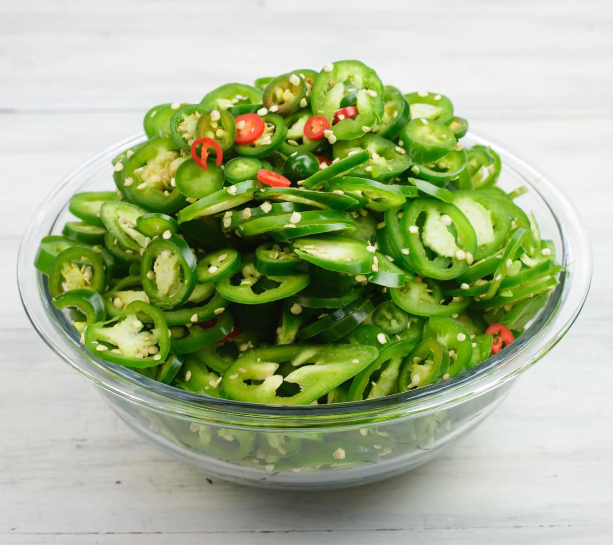 3 lbs. of sliced jalapeno peppers in a bowl.