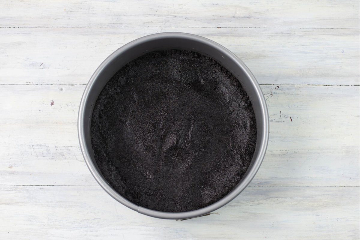 Dark chocolate cookie crust pressed into a 9-inch springform pan.