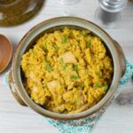 Instant Pot Chicken and yellow rice in a stoneware serving bowl.