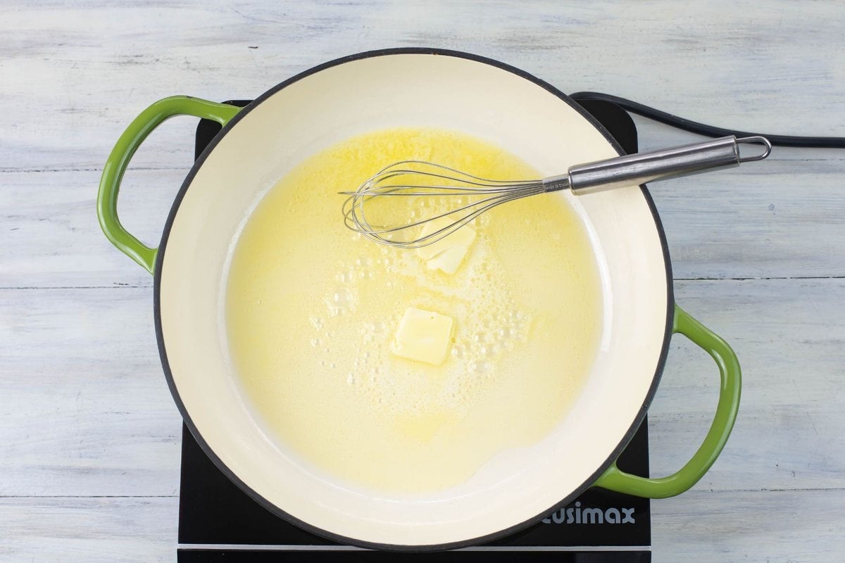Heating butter and olive oil in a large skillet.