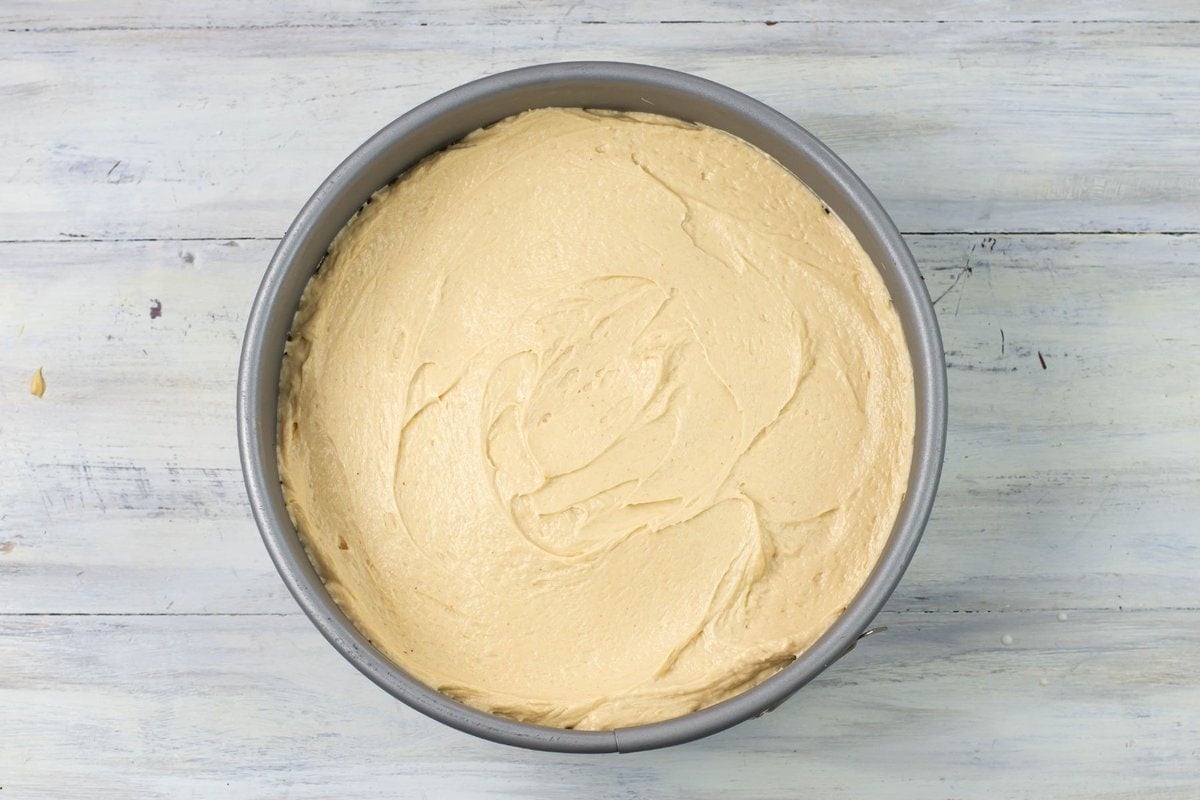 Smoothing the Peanut Butter Cheesecake filling top.