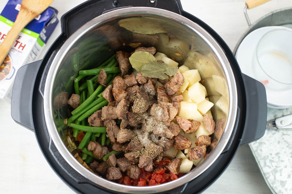 Retuning the browned meat to the Instant Pot.