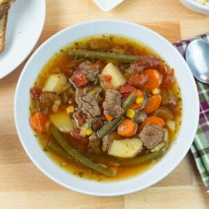 Instant Pot Beef Vegetable Soup in a bowl served with soup crackers.