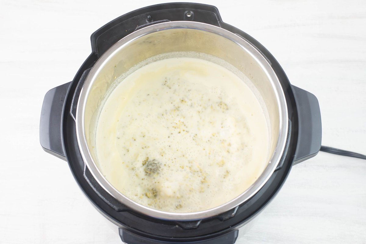 Creamy Instant Pot Broccoli Soup thickening in the Instant Pot.