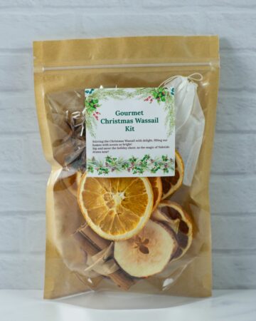 Christmas Wassail Kit in a brown kraft bag with a window showing the ingredients.