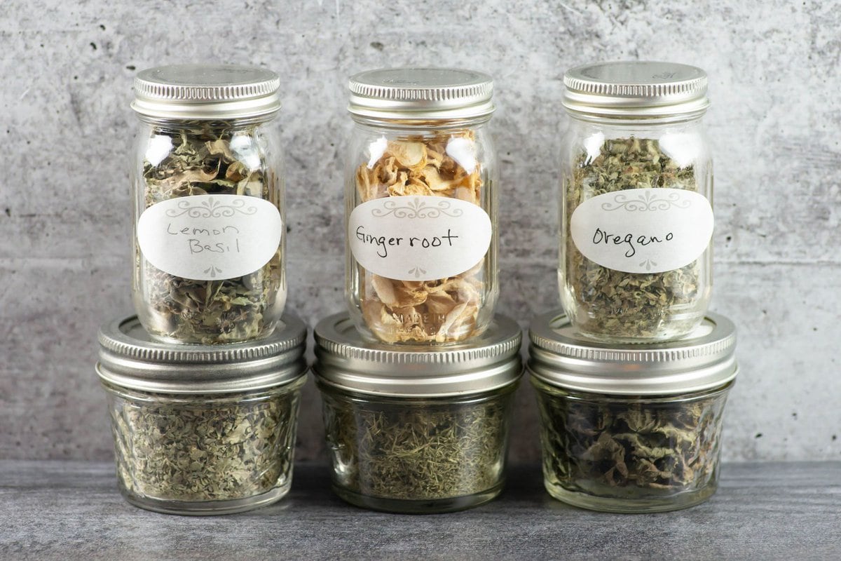 Dehydrated herbs in small jars.